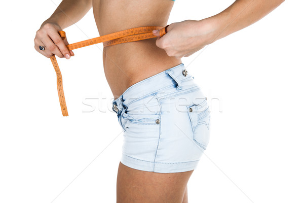 girl measures the waist Stock photo © mizar_21984