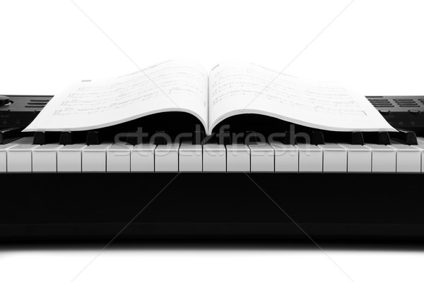 Tasti del pianoforte musicale libro bianco nero tasti piano Foto d'archivio © mizar_21984