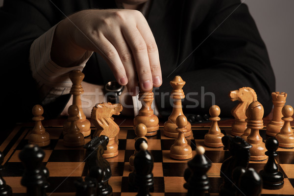 man makes a move chess figure Stock photo © mizar_21984