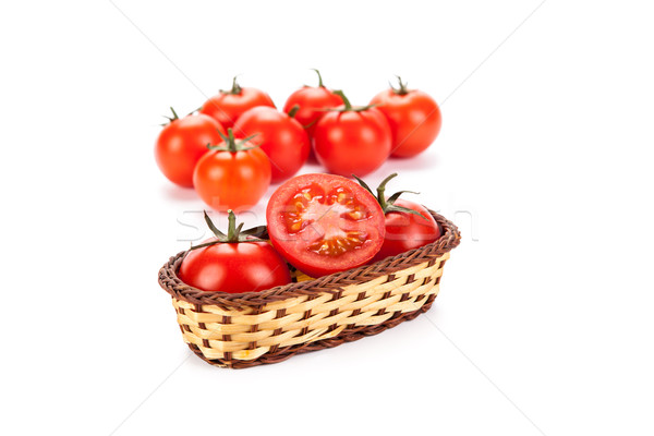 Stock photo: red tomatoes in a small basket on a white background