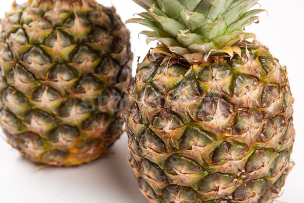 two big pineapples on a white background Stock photo © mizar_21984