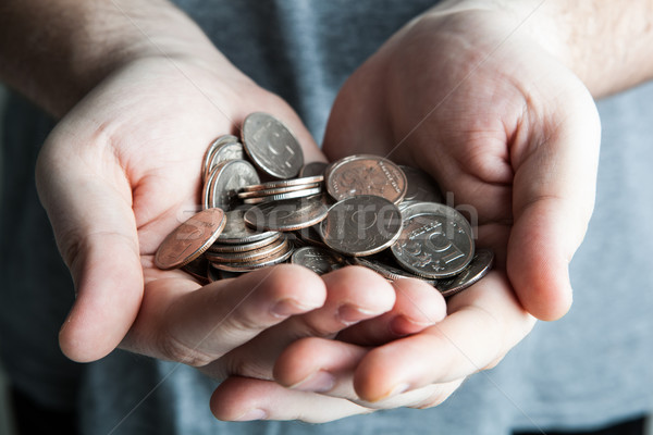 Stock photo: five-ruble coin in man's hands