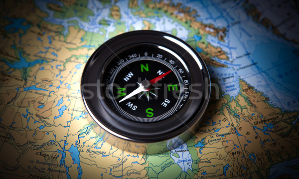 tourist compass lying on a map Stock photo © mizar_21984