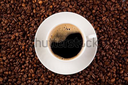 cup of black coffee with roasted coffe beans Stock photo © mizar_21984