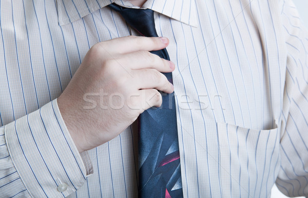 hand business man straightens his tie Stock photo © mizar_21984