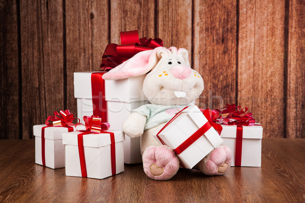white gift boxes and soft toy on a wood Stock photo © mizar_21984
