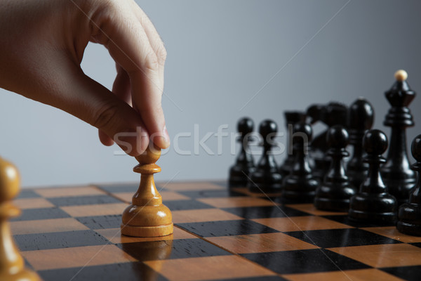 man makes a move chess pawn Stock photo © mizar_21984
