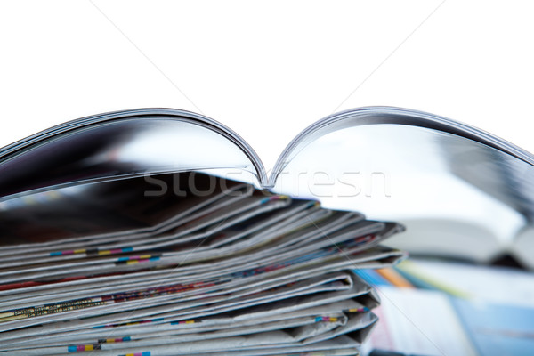 Stock photo: stack of newspapers, magazine, and keyboard close-up