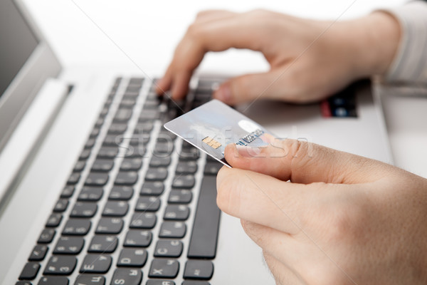 Kezek tart hitelkártya laptopot használ számítógép közelkép Stock fotó © mizar_21984