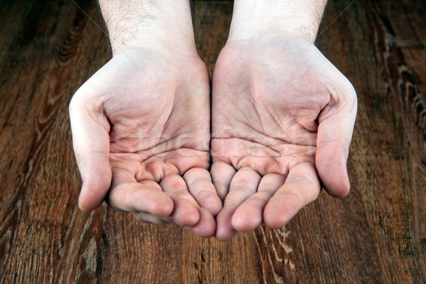 male hands on a wooden background Stock photo © mizar_21984