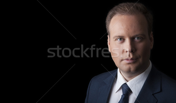 man in a suit and tie on a black background Stock photo © mizar_21984