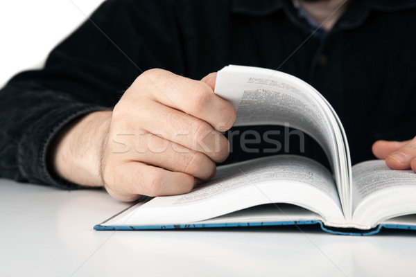 hands of a man thumbing a book closeup Stock photo © mizar_21984