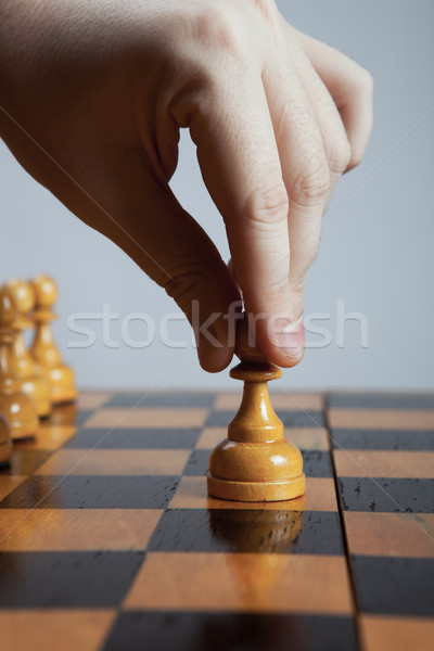 man makes a move chess pawn Stock photo © mizar_21984