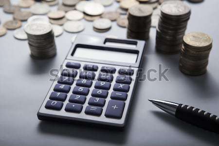 Stock photo: handful of Russian rubles with calculator