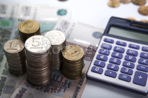 Stock photo: stacks of Russian rubles with calculator