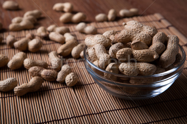 large grains of peanuts in the shell and the bowl Stock photo © mizar_21984