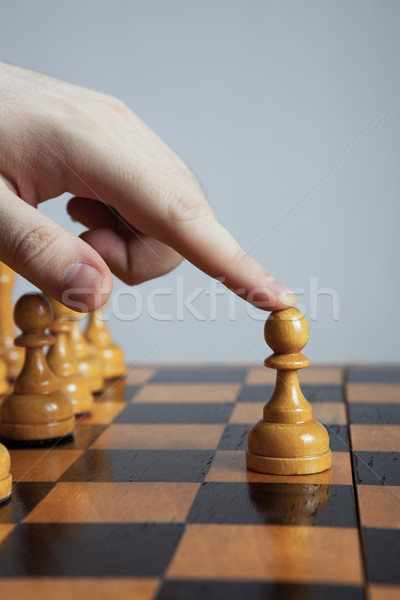 man makes a move chess pawn Stock photo © mizar_21984