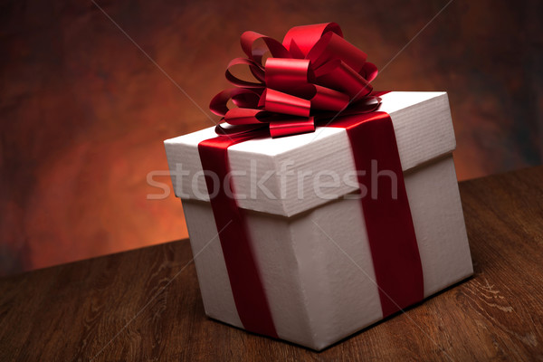 Stock photo: one large white gift box on the wood table