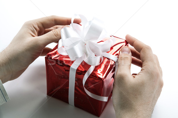 Man's hands give you a gift box Stock photo © mizar_21984