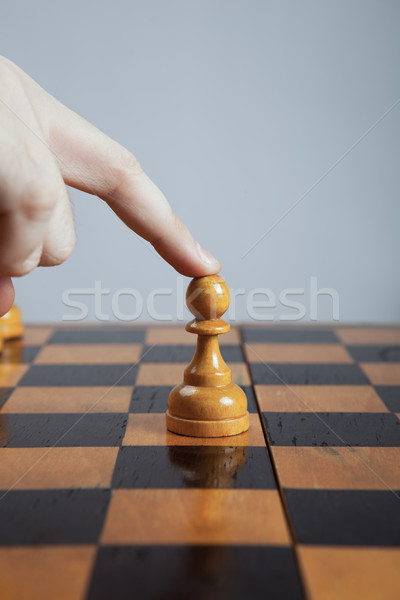 man makes a move chess pawn Stock photo © mizar_21984