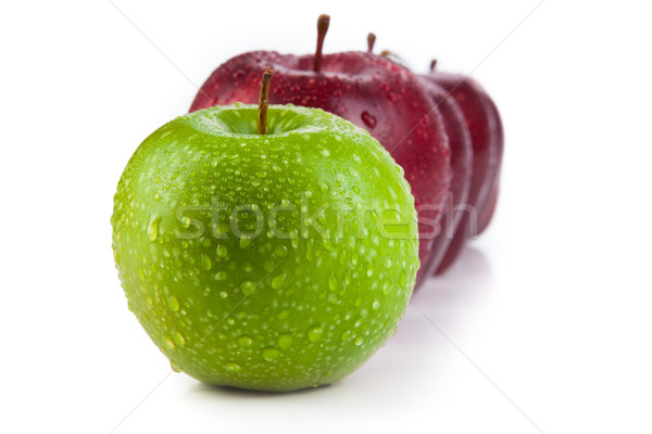 maroon apples lined up in a row and green apple closeup Stock photo © mizar_21984