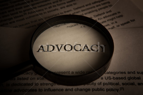 document with the title of advocacy under a magnifying glass Stock photo © mizar_21984