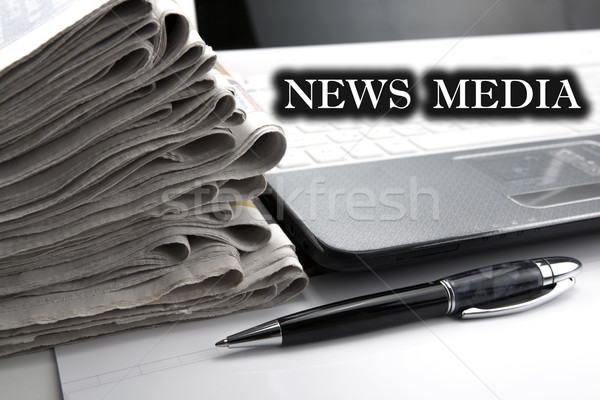 Stock photo: stack of newspapers and keyboard close-up