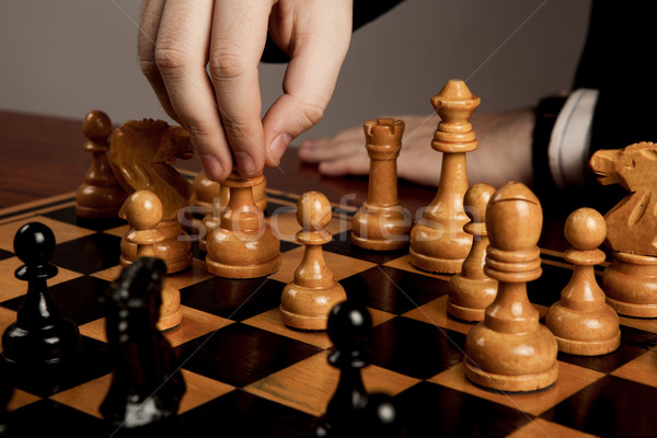man makes a move chess figure Stock photo © mizar_21984