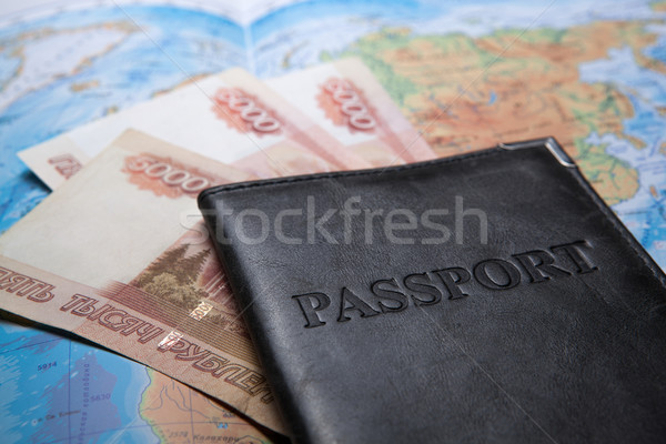 passport in the bag on a map with bank notes Stock photo © mizar_21984