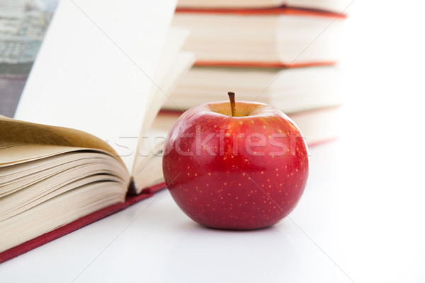 Stock photo: open books with red apple 