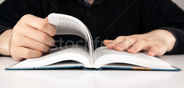 man is looking for information in the dictionary Stock photo © mizar_21984