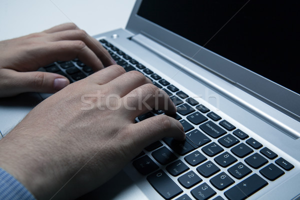 Stock photo: man is working at a computer
