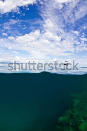 Stock photo: Small boat on the reef