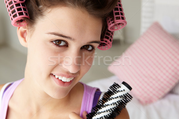 Teenage girl with hair in curlers Stock photo © monkey_business