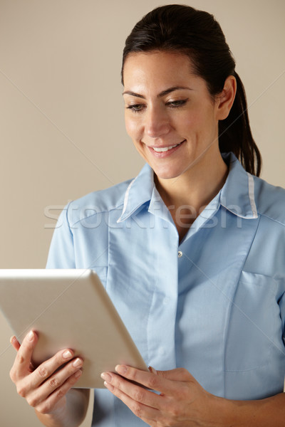 UK nurse using computer tablet Stock photo © monkey_business