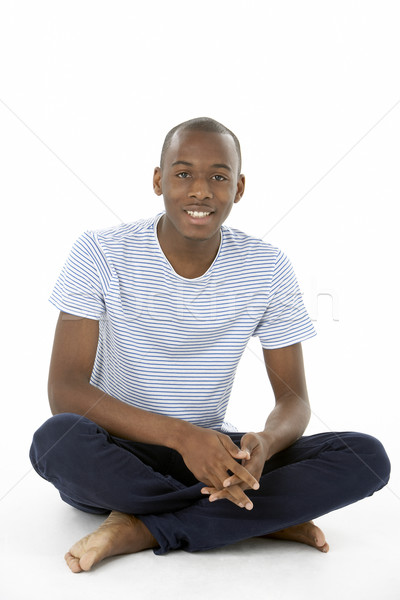 Tizenéves fiú ül stúdió fiú szín fiatal Stock fotó © monkey_business