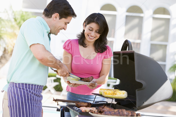 Casal cozinhar churrasco feliz jardim cor Foto stock © monkey_business