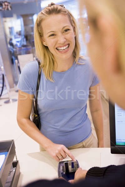 Woman entering security details for credit card purchase Stock photo © monkey_business