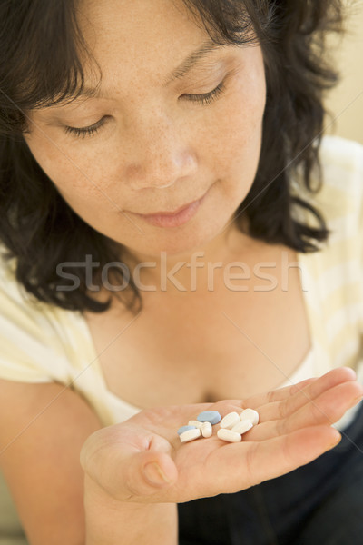 Stock photo: Woman Taking Pills