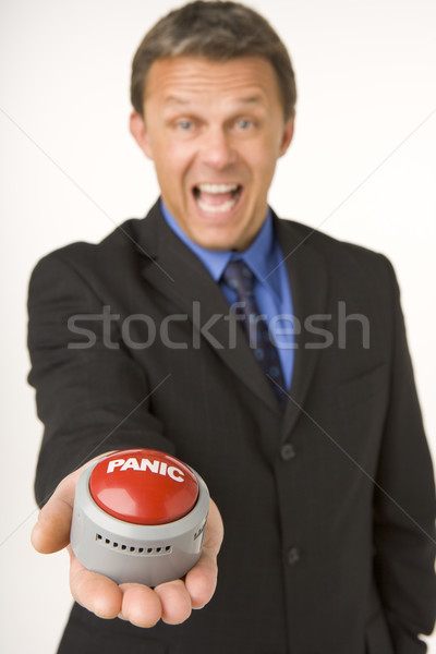 üzletember tart pánik gomb üzlet stúdió Stock fotó © monkey_business