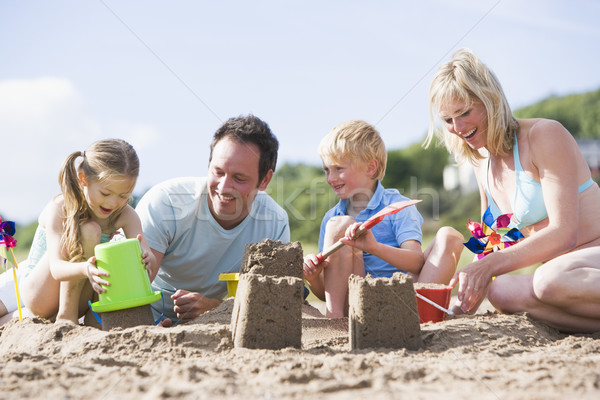 Foto stock: Família · praia · areia · castelos · sorridente