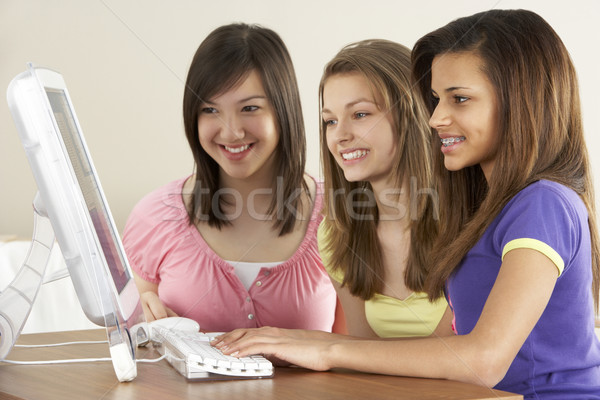 Teenage Girlfriends on Computer at Home Stock photo © monkey_business