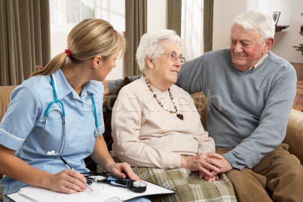Senior Couple In Discussion With Health Visitor At Home Stock photo © monkey_business