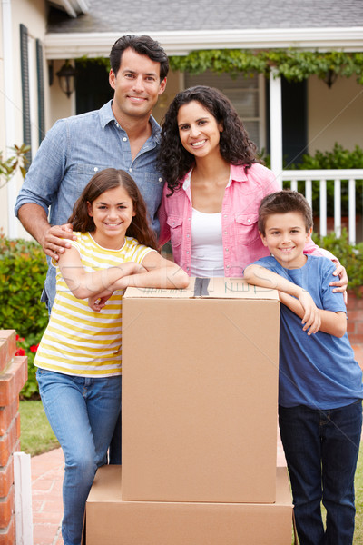 Stock photo: Family moving into new house