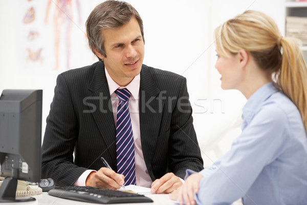 Doctor with female patient Stock photo © monkey_business