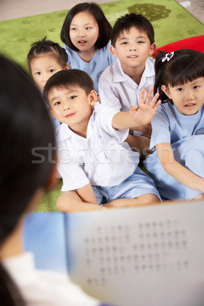 Tanár olvas diákok kínai iskola osztályterem Stock fotó © monkey_business