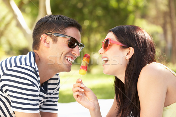 Couple Relaxing Together In Garden Eating Ice Lolly Stock photo © monkey_business