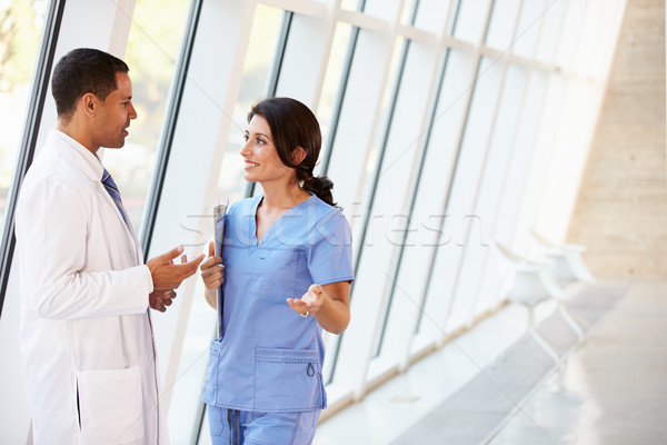 Medical Staff Having Discussion In Modern Hospital Corridor Stock photo © monkey_business