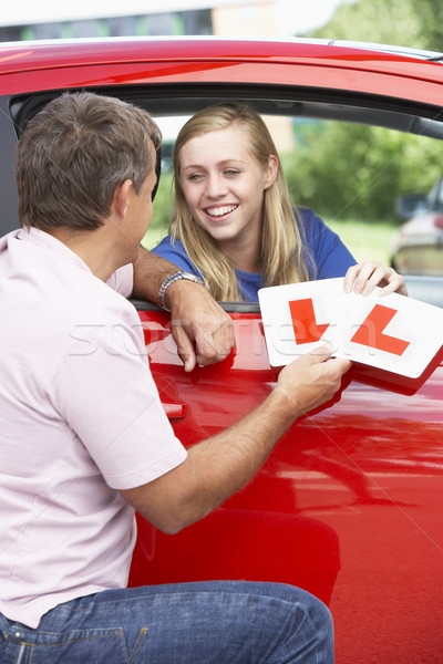 Teenage Girl Receiving Her Learner Plates Stock photo © monkey_business