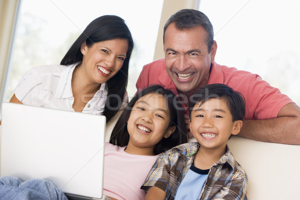 Zdjęcia stock: Rodziny · salon · laptop · uśmiechnięty · komputera · kobieta